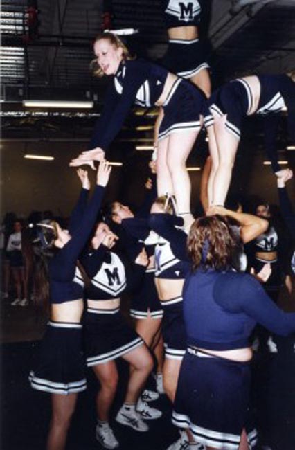 midd cheer - ending stunt, i'm on the right bent over